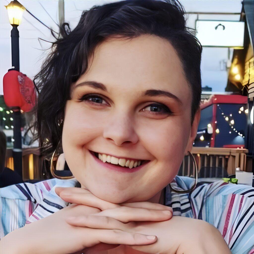 Smiling person outdoors at evening